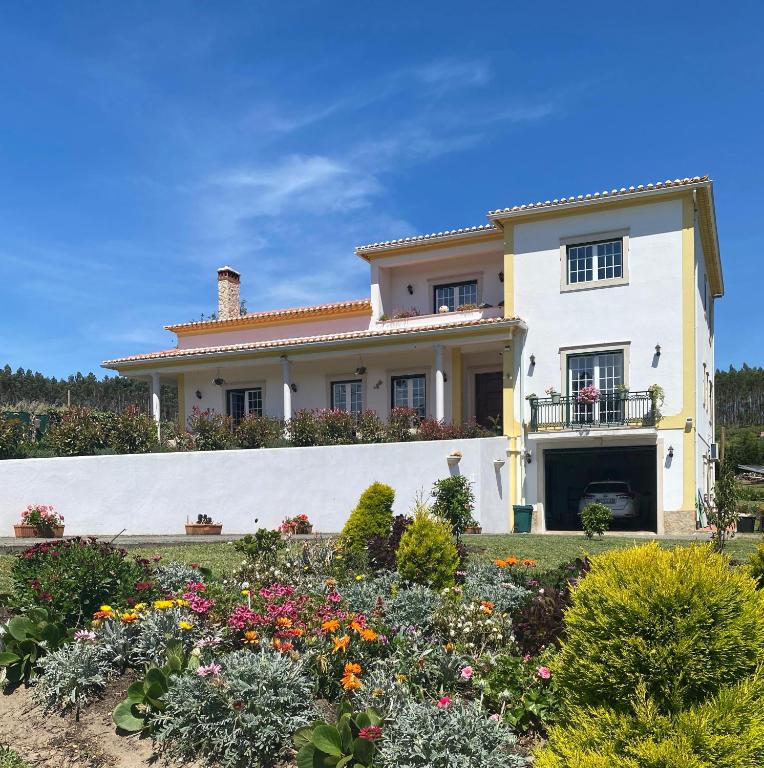 a house with a garden in front of it at Serenity in Coto