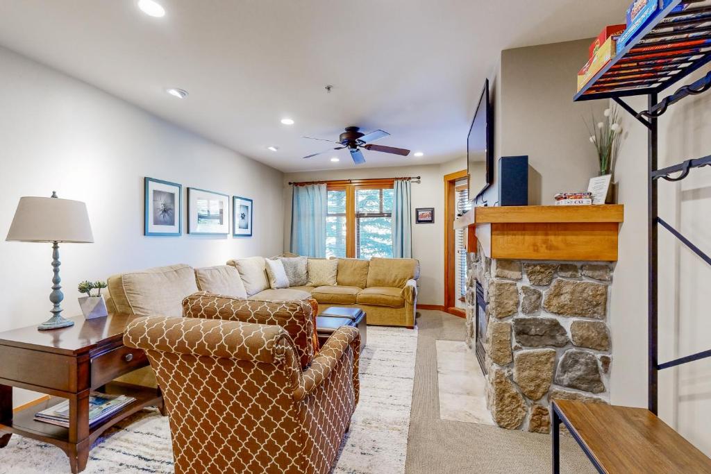 a living room with a couch and a fireplace at Eagle Springs Mountain Retreat in Solitude