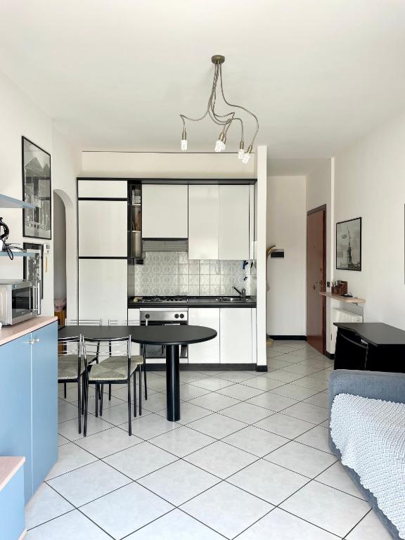 a kitchen and dining room with a table and chairs at Casa Lucia in Lignano Sabbiadoro