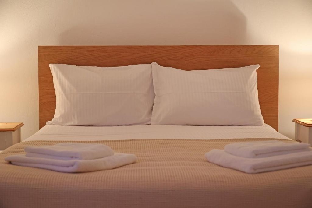 Postel nebo postele na pokoji v ubytování Aira Apartments