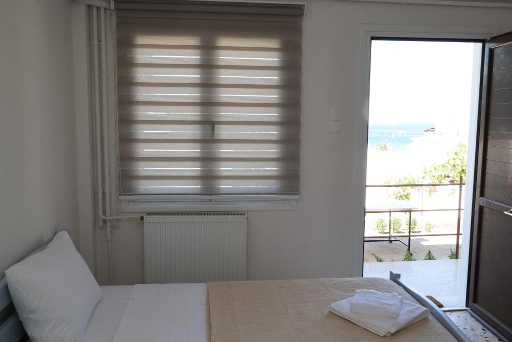 Postel nebo postele na pokoji v ubytování Aira Apartments