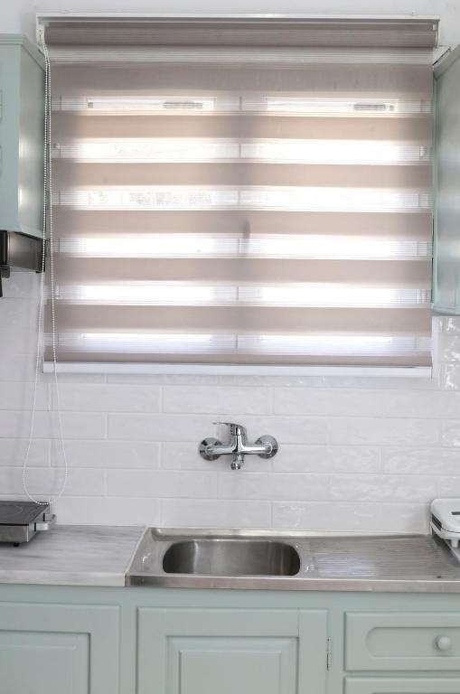 Kuchyň nebo kuchyňský kout v ubytování Aira Apartments
