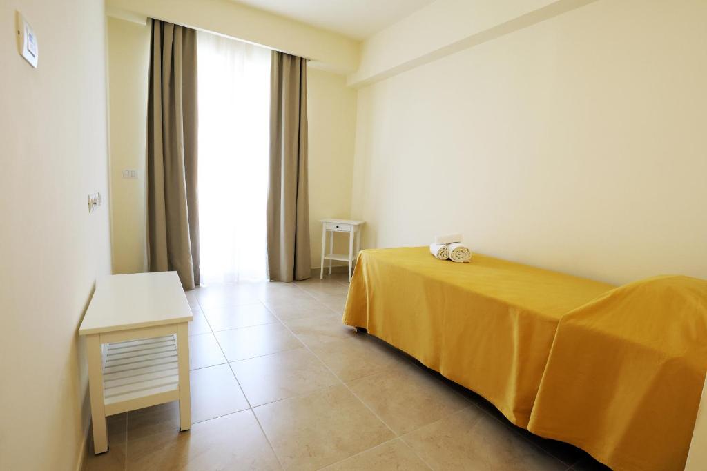 Postel nebo postele na pokoji v ubytování Verdello Home