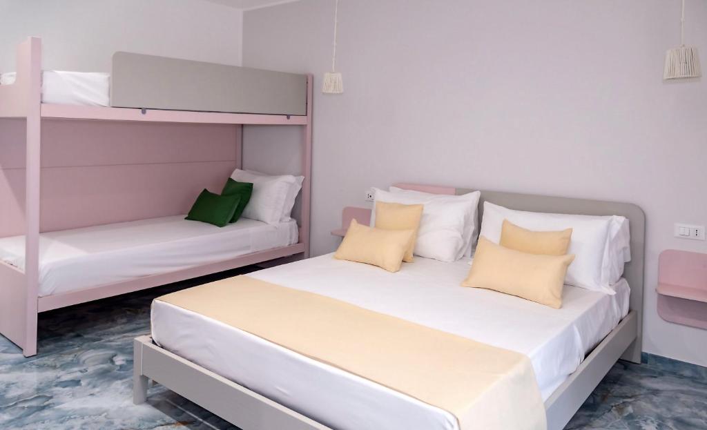 Postel nebo postele na pokoji v ubytování Maison Matie B&B Ercolano