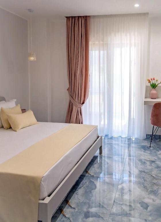 Postel nebo postele na pokoji v ubytování Maison Matie B&B Ercolano