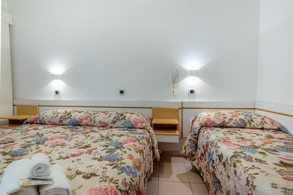 Postel nebo postele na pokoji v ubytování Hotel Ilde