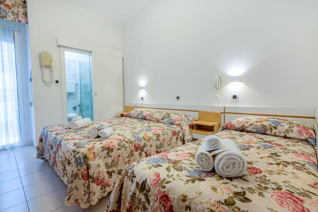 Postel nebo postele na pokoji v ubytování Hotel Ilde