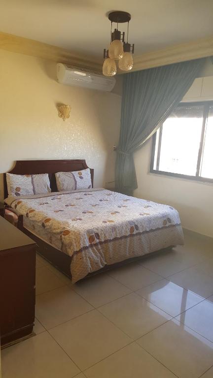 Postel nebo postele na pokoji v ubytování Al Khaleej Hotel Apartments