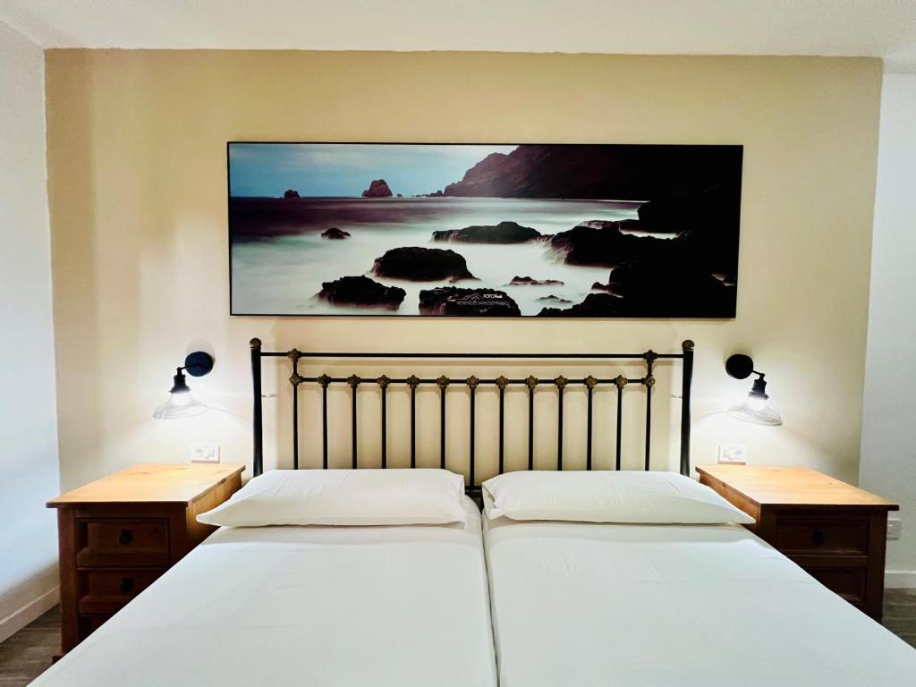 A bed or beds in a room at Apartamentos Frontera