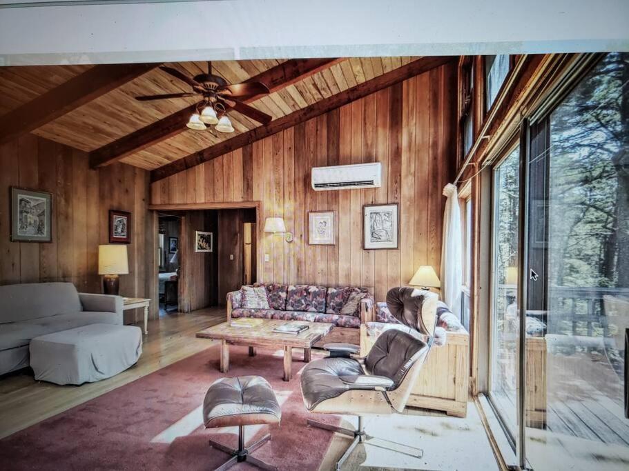 a living room with a couch and a table at Nature Lover's Nest in Wellfleet