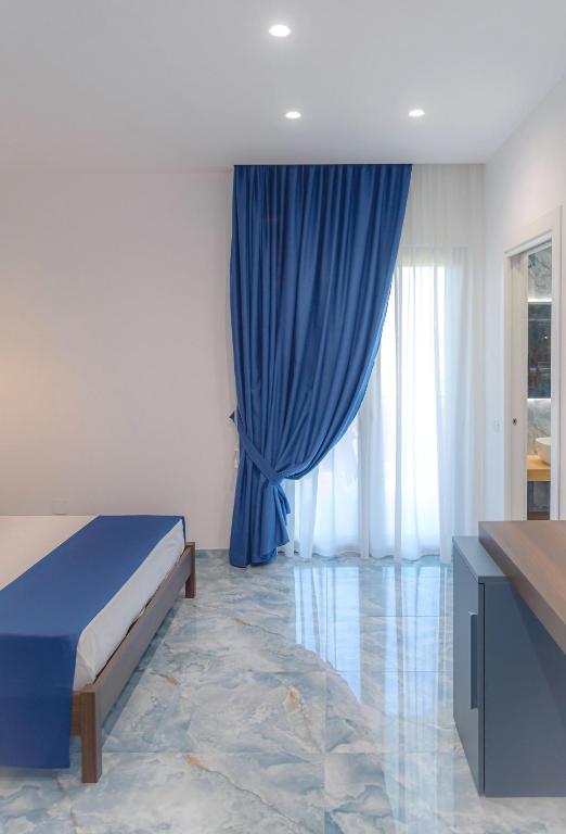 Postel nebo postele na pokoji v ubytování Maison Matie B&B Ercolano