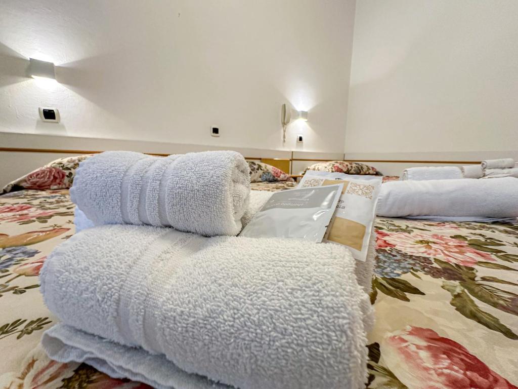 Postel nebo postele na pokoji v ubytování Hotel Ilde
