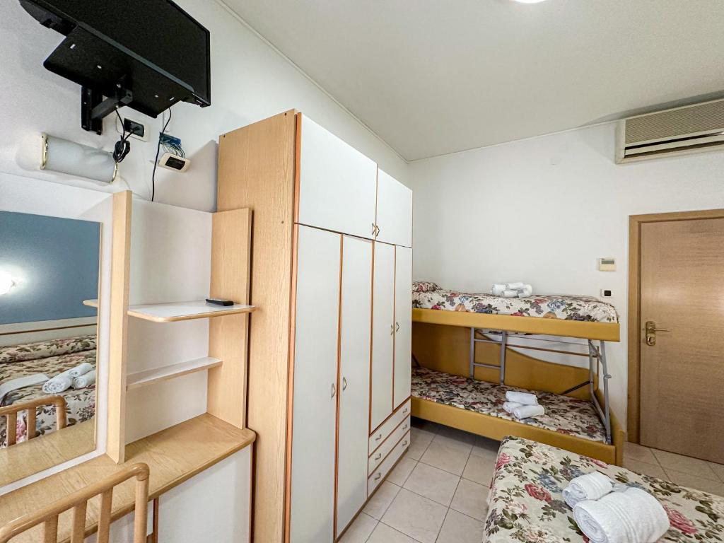 Postel nebo postele na pokoji v ubytování Hotel Ilde