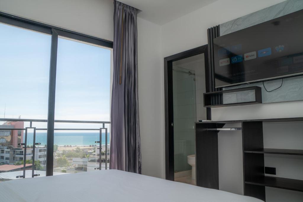 Postel nebo postele na pokoji v ubytování Manta Surf Hotel