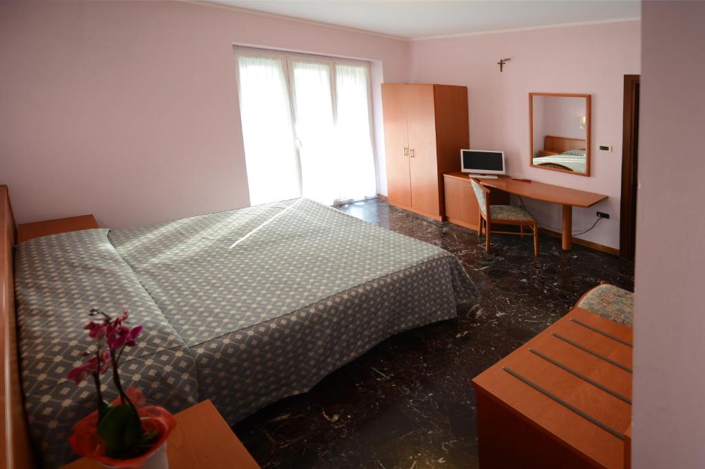 Postel nebo postele na pokoji v ubytování Albergo Venaria Reale da Matteo