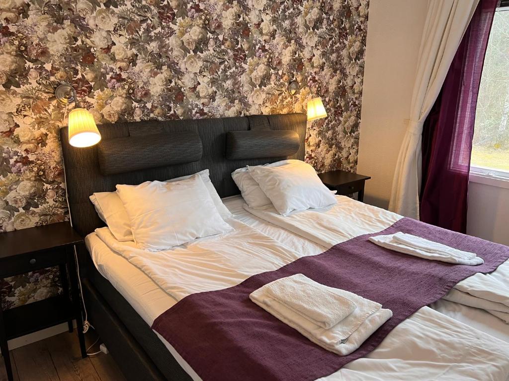 Postel nebo postele na pokoji v ubytování Böda Hotell