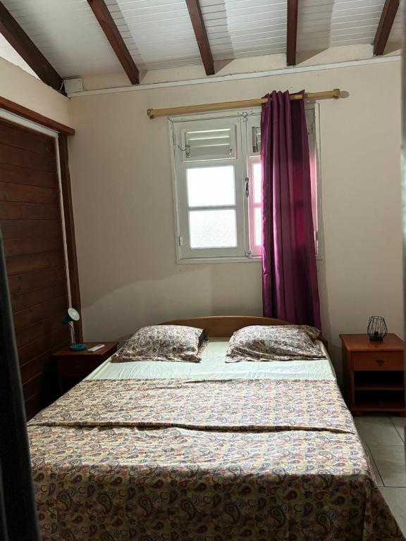 Postel nebo postele na pokoji v ubytování Petit MADRAS