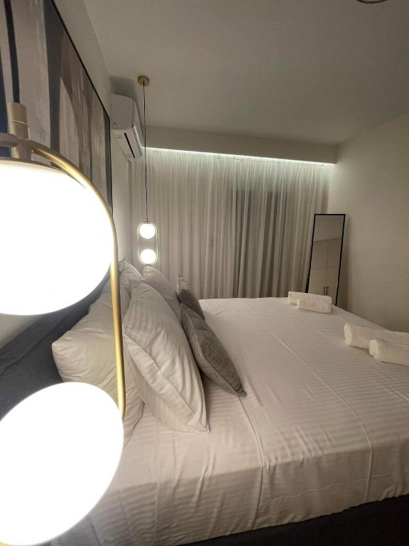 Postel nebo postele na pokoji v ubytování Olive Luxury Suite