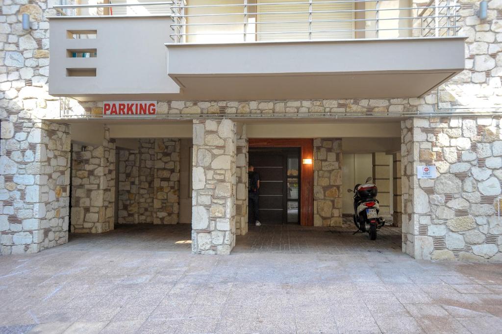 a building with a ramp with a motorcycle parked in it at COZY GOLD #DTerra Apartments# FREE PRIVATE PARKING!! in Thessaloniki
