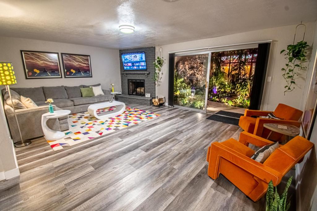a living room with a couch and a fireplace at Las Vegas Oasis Home Primary in Las Vegas
