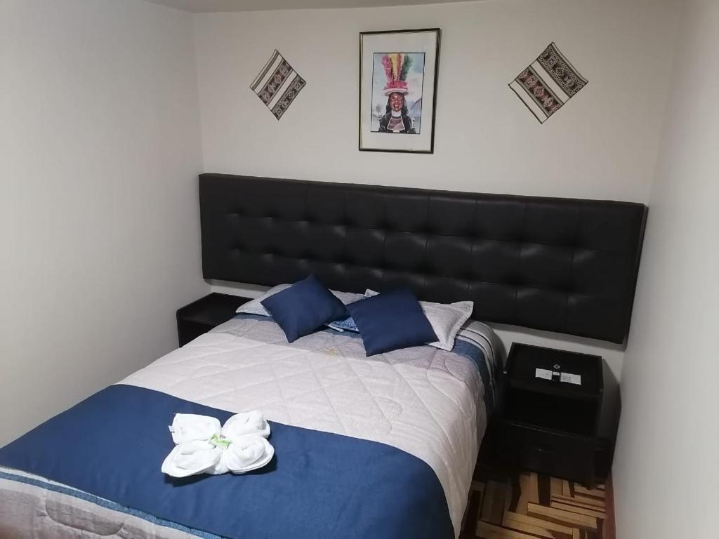Postel nebo postele na pokoji v ubytování Hostal San Antonio Inn