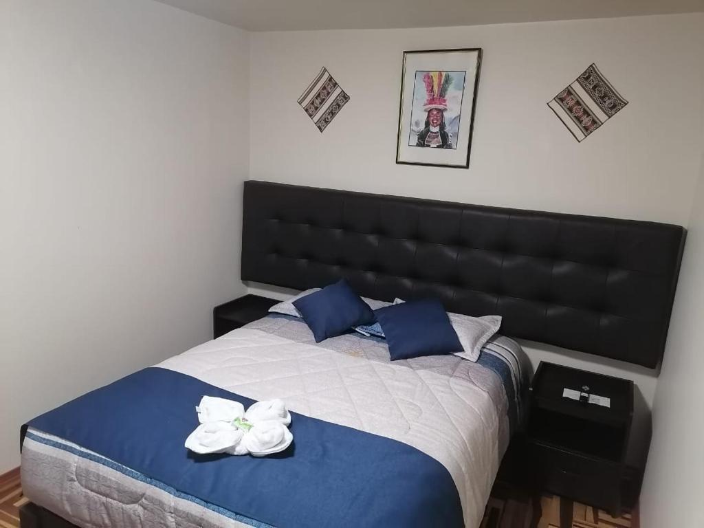 Postel nebo postele na pokoji v ubytování Hostal San Antonio Inn