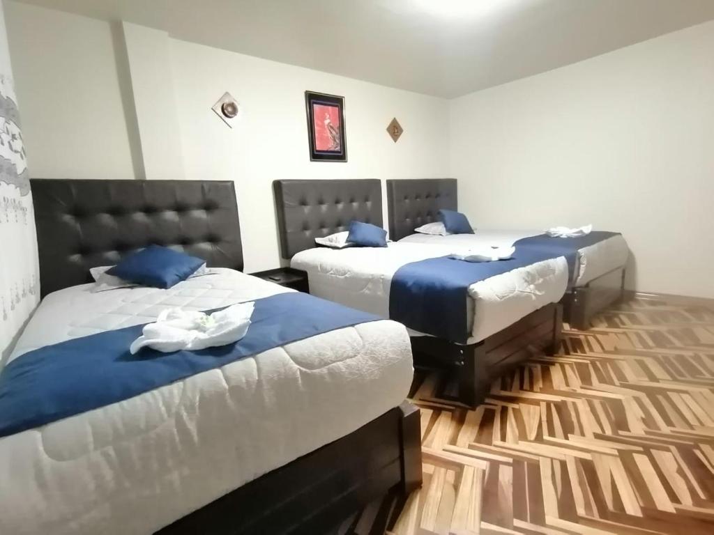 Postel nebo postele na pokoji v ubytování Hostal San Antonio Inn
