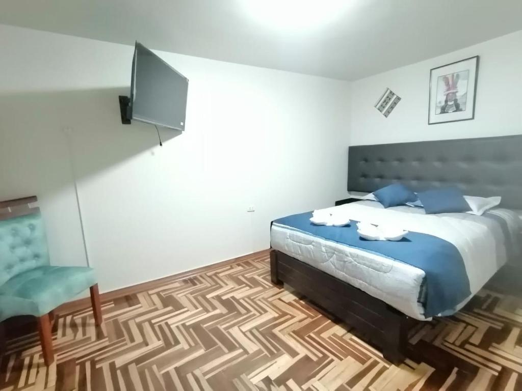 Postel nebo postele na pokoji v ubytování Hostal San Antonio Inn