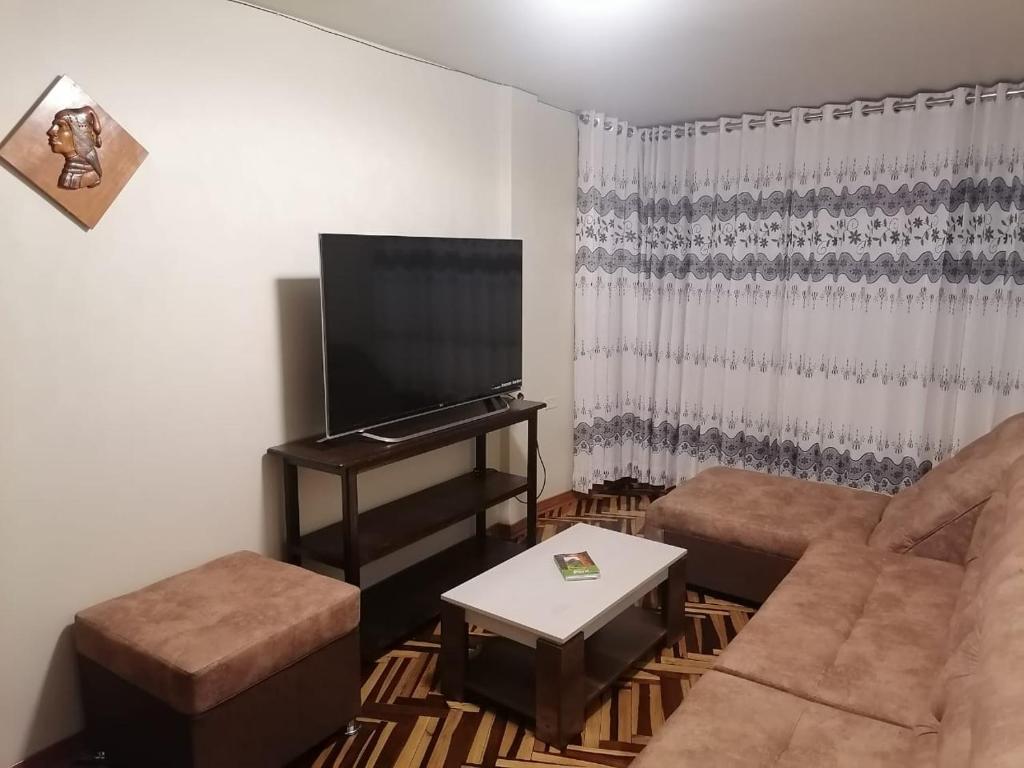 TV a/nebo společenská místnost v ubytování Hostal San Antonio Inn
