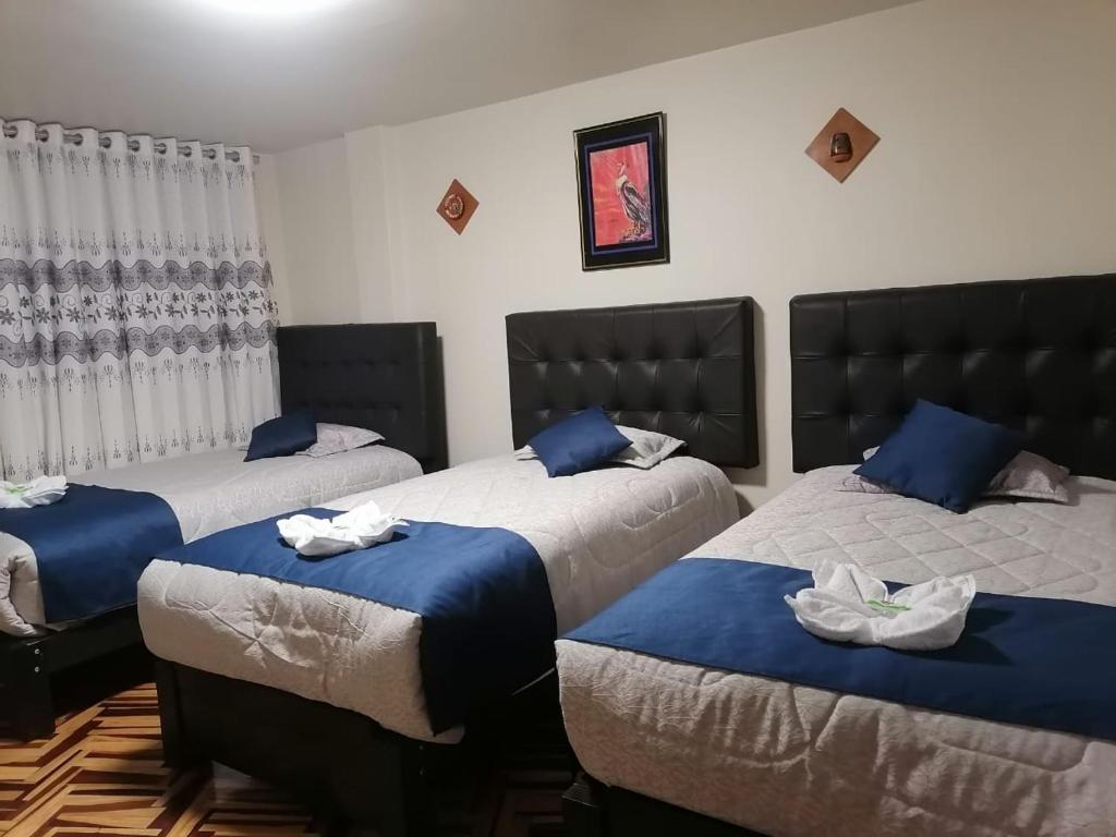 Postel nebo postele na pokoji v ubytování Hostal San Antonio Inn