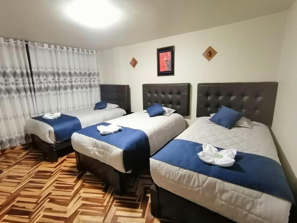 Postel nebo postele na pokoji v ubytování Hostal San Antonio Inn