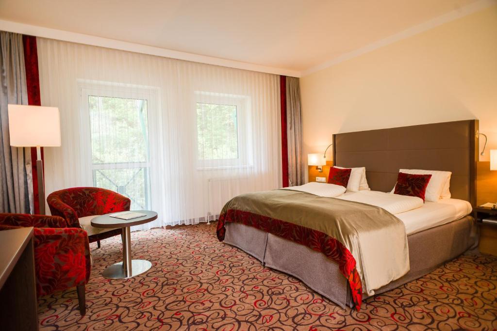 Postel nebo postele na pokoji v ubytování Hotel Schneeberghof