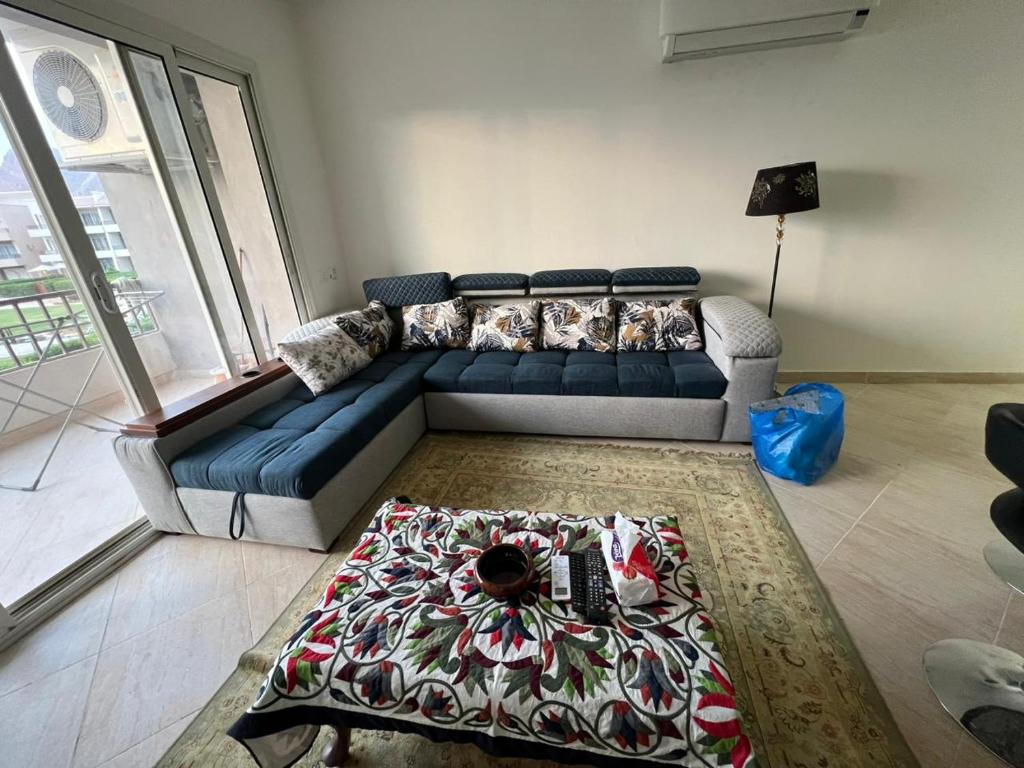 a living room with a couch and a table at Ain Sokhna Chalet in Ain Sokhna