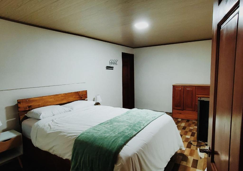 Postel nebo postele na pokoji v ubytování Grand Luna - Monteverde