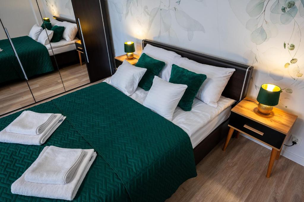 Ένα ή περισσότερα κρεβάτια σε δωμάτιο στο Green Apartment