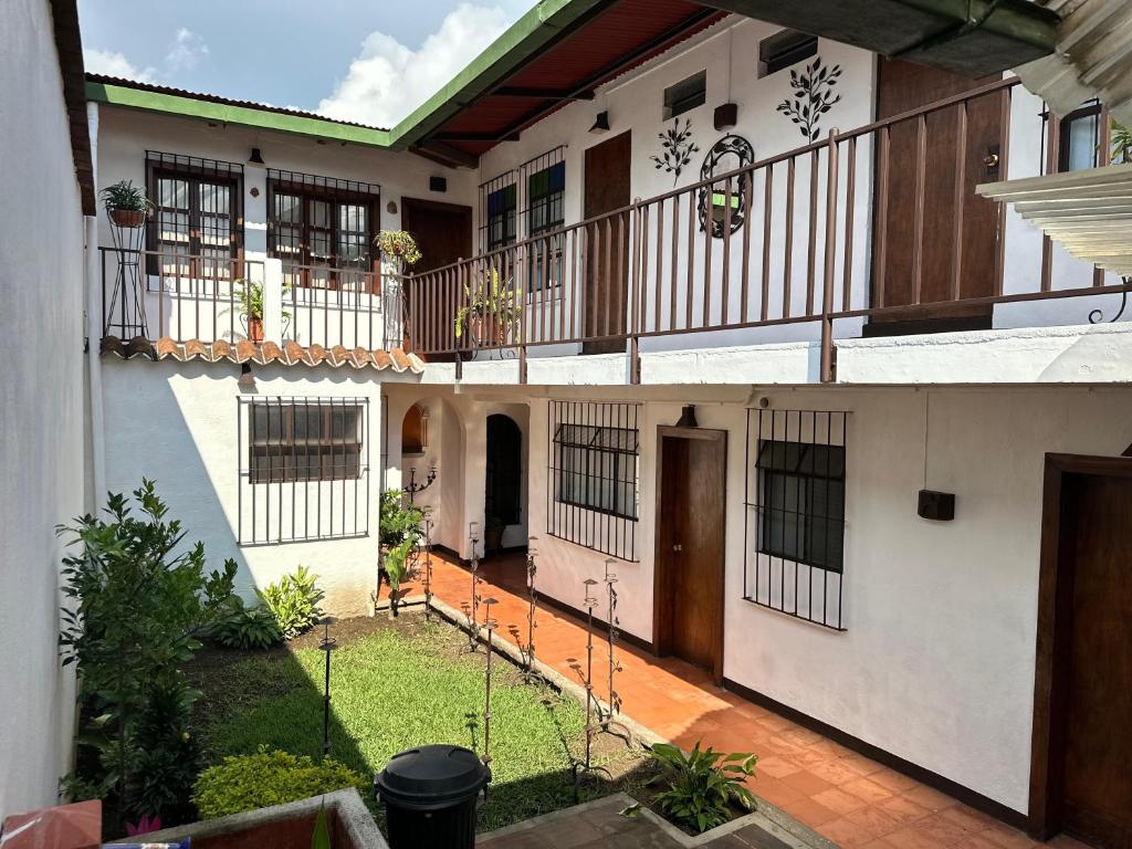 an external view of a house with a courtyard at Hotel Casa Blanca Antigua Guatemala in Antigua Guatemala