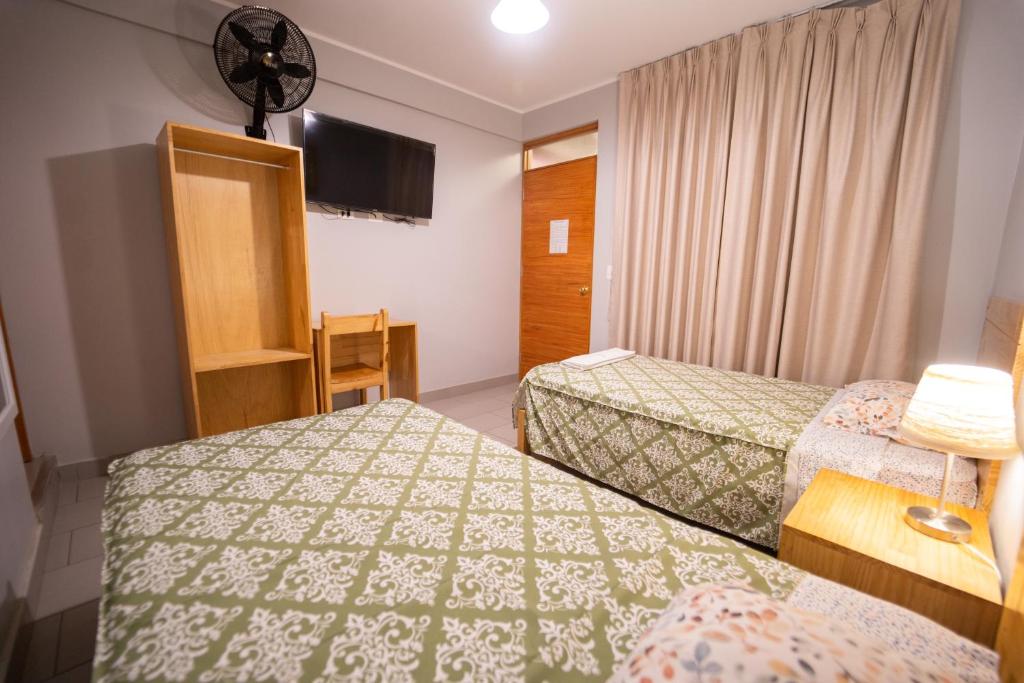 Letto o letti in una camera di Hostal Los Balcones II