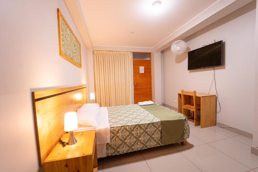 Letto o letti in una camera di Hostal Los Balcones II