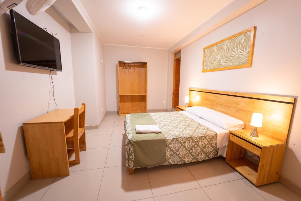 Letto o letti in una camera di Hostal Los Balcones II