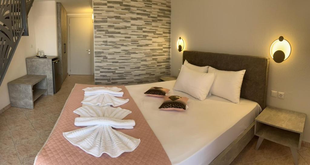 Postel nebo postele na pokoji v ubytování Ellas Hotel