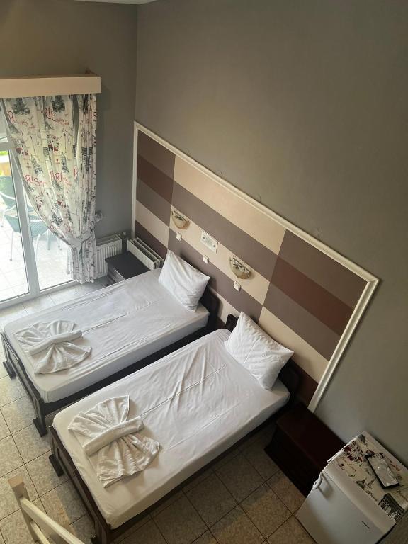 Postel nebo postele na pokoji v ubytování Ellas Hotel