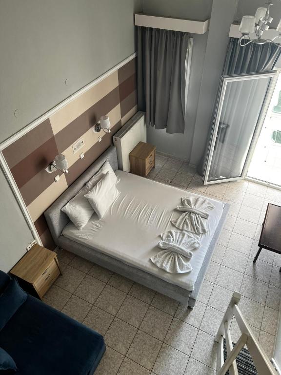 Postel nebo postele na pokoji v ubytování Ellas Hotel