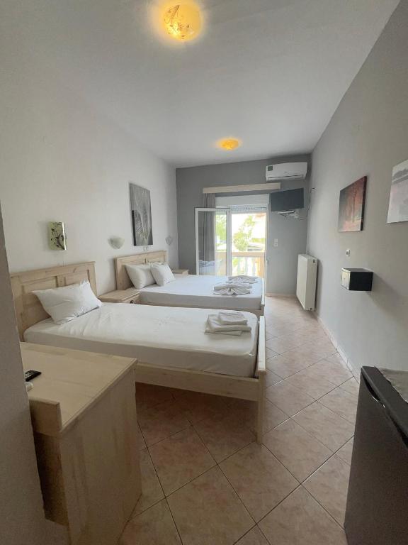 Postel nebo postele na pokoji v ubytování Ellas Hotel