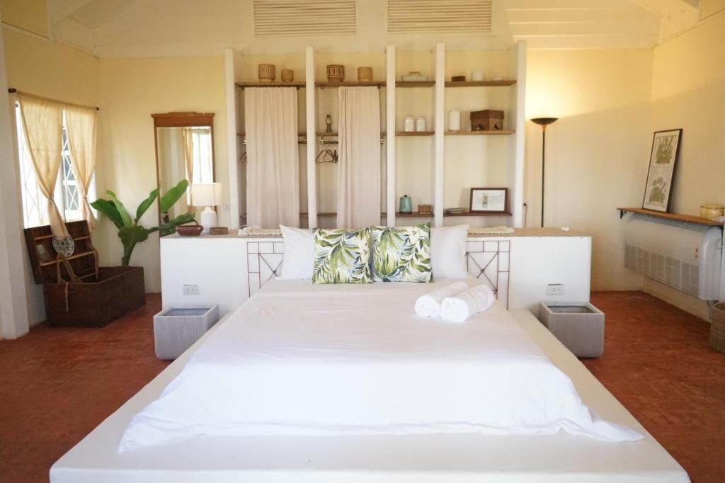 a bedroom with a large white bed in a room at The Shore Koh Chang Boutique Resort in Ko Chang