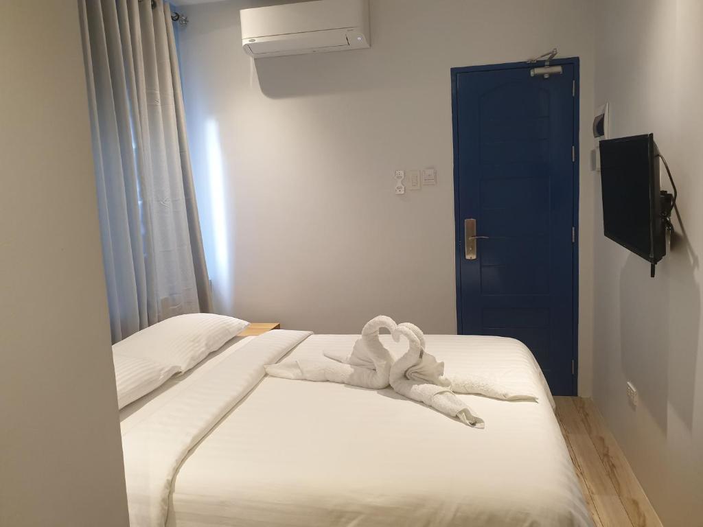 Postel nebo postele na pokoji v ubytování Oktowaves hotel