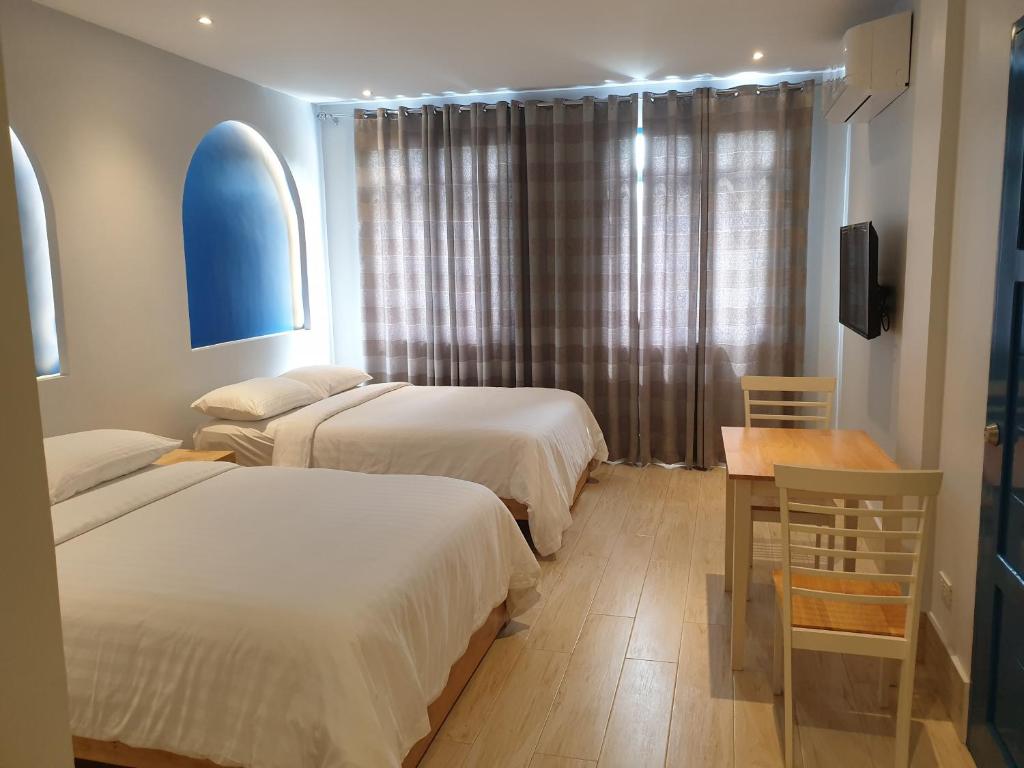 Postel nebo postele na pokoji v ubytování Oktowaves hotel