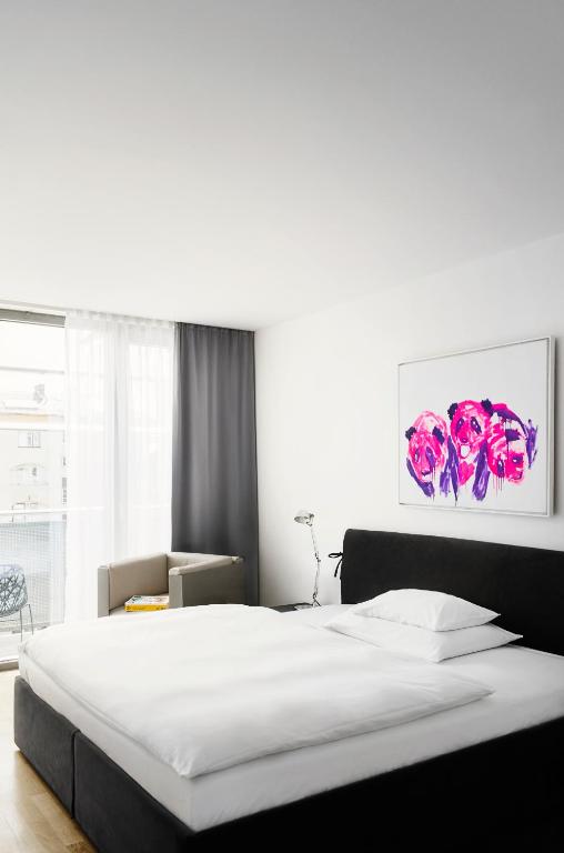 Voodi või voodid majutusasutuse Augarten Art Hotel, a Member of Design Hotels toas