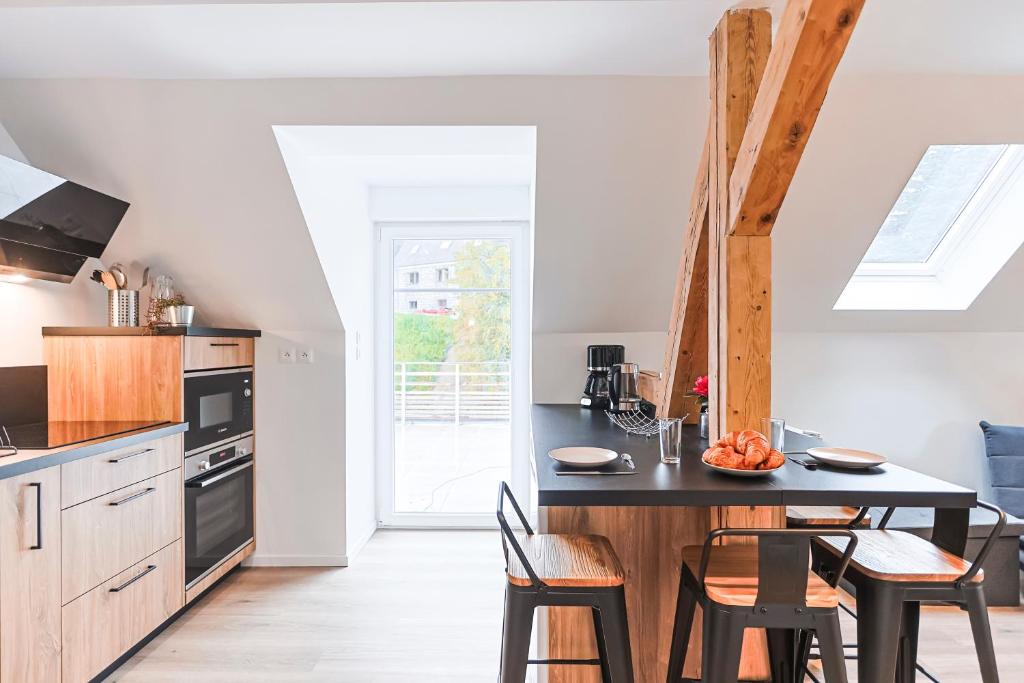 Kuchyň nebo kuchyňský kout v ubytování Appartements Les Vosges