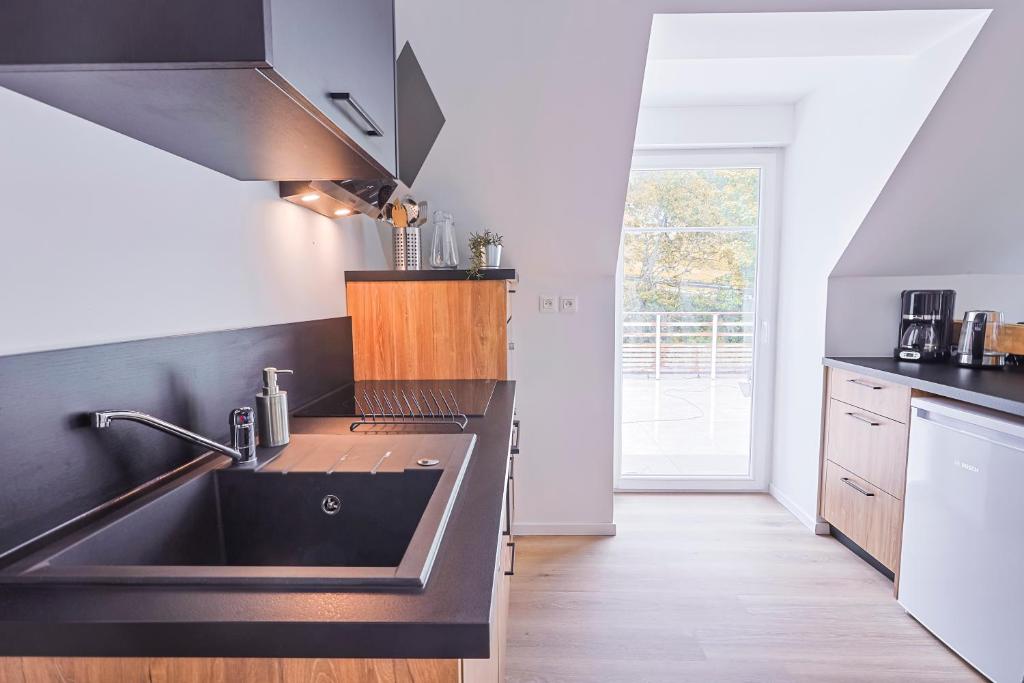 Kuchyň nebo kuchyňský kout v ubytování Appartements Les Vosges