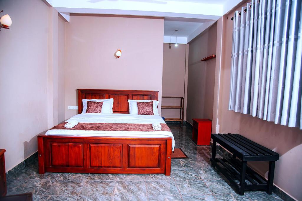 Postel nebo postele na pokoji v ubytování Freedom Guest Inn Ella